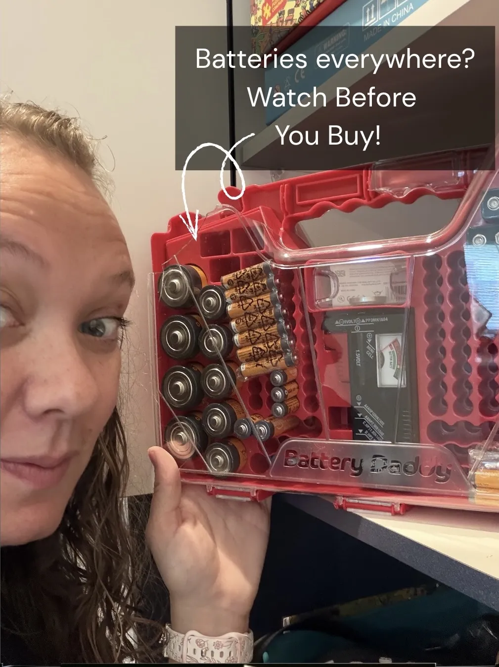 Amber holding an open Battery Daddy storage case.